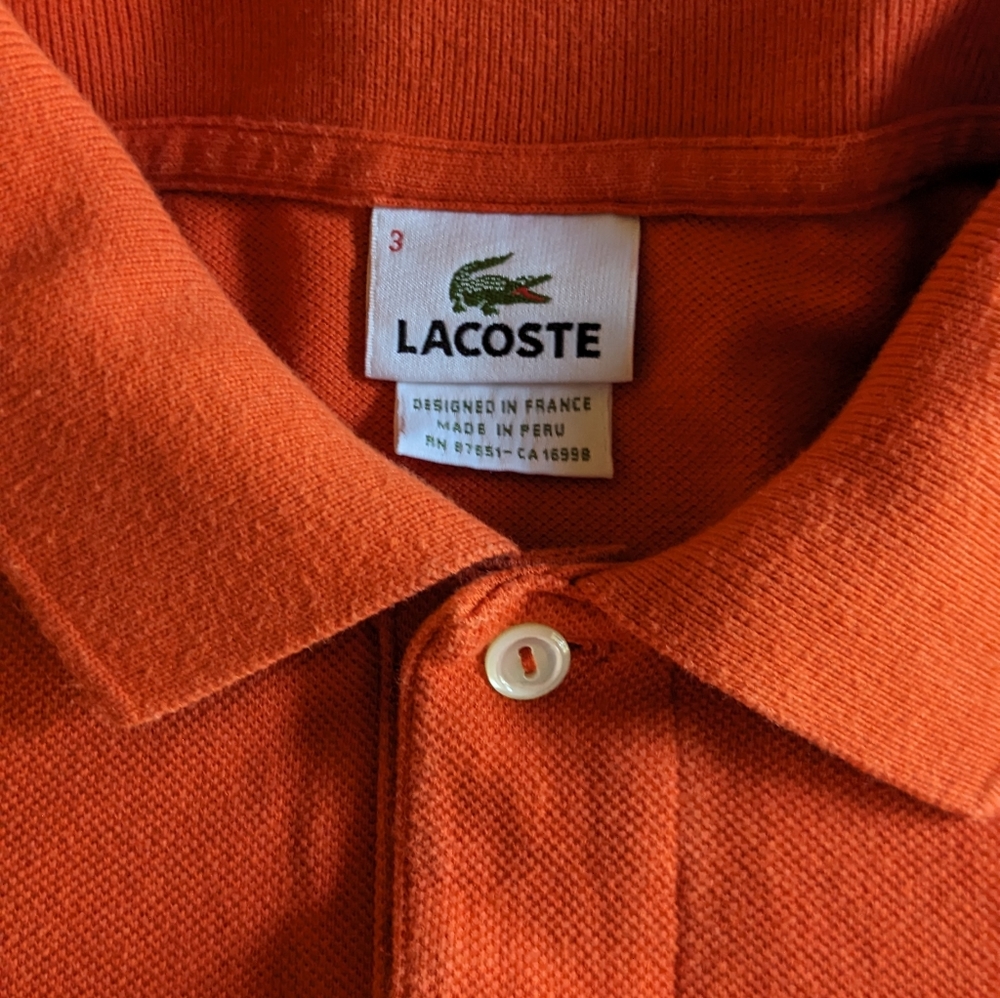 Men's Lacoste orange polo small, size 3
